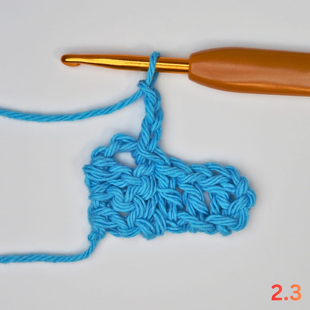 C2C Row 2 step 3: slip stitch into the chain-3 space of Row 1.