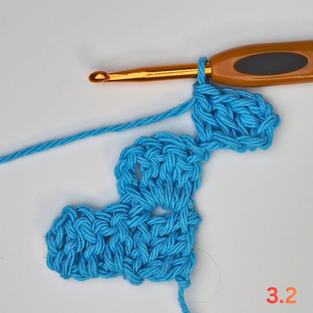 C2C Row 3 step 2: complete the first new block with three double crochets.